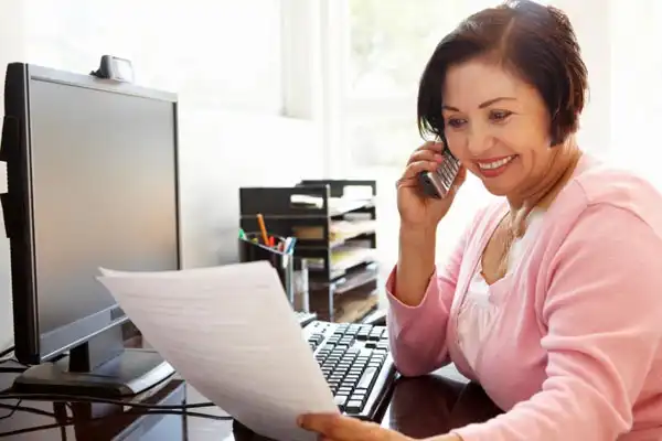 Female financial planning client on the phone with her investment advisor